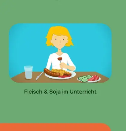 Man sieht ein Mädchen vor einem Teller mit einem Würstchen.